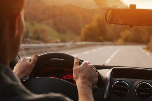 view of a driver drinving his car