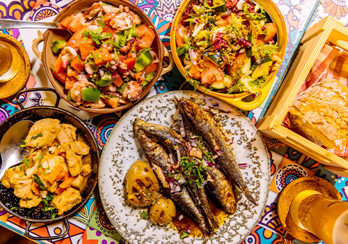 roteiro gastronómico: Jantar tradicional português com sardinhas assadas e salada de polvo